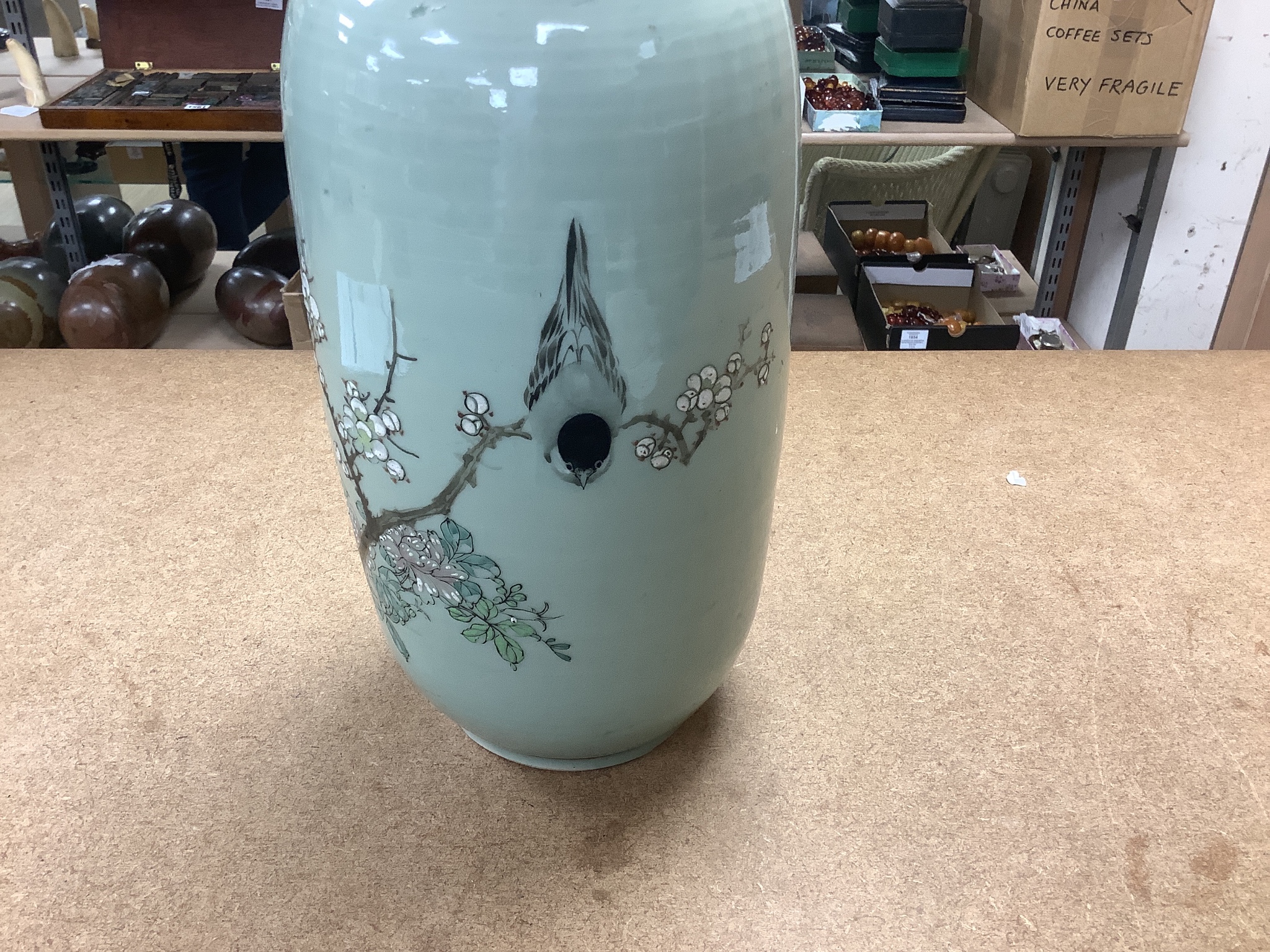 A pair of 19th century Japanese celadon glazed vases (drilled) with hardwood stands, total height 31cm